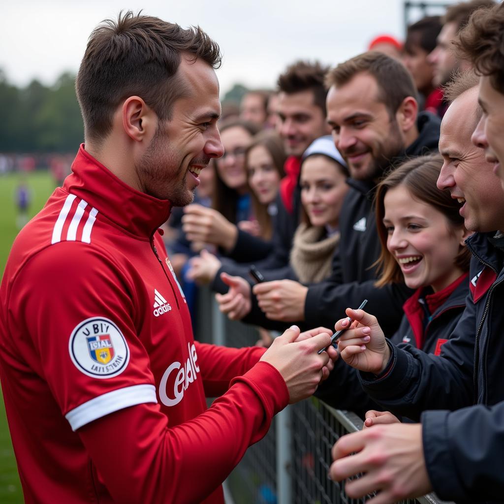 Adrian Kiermaszek mit Fans von Bayer Leverkusen