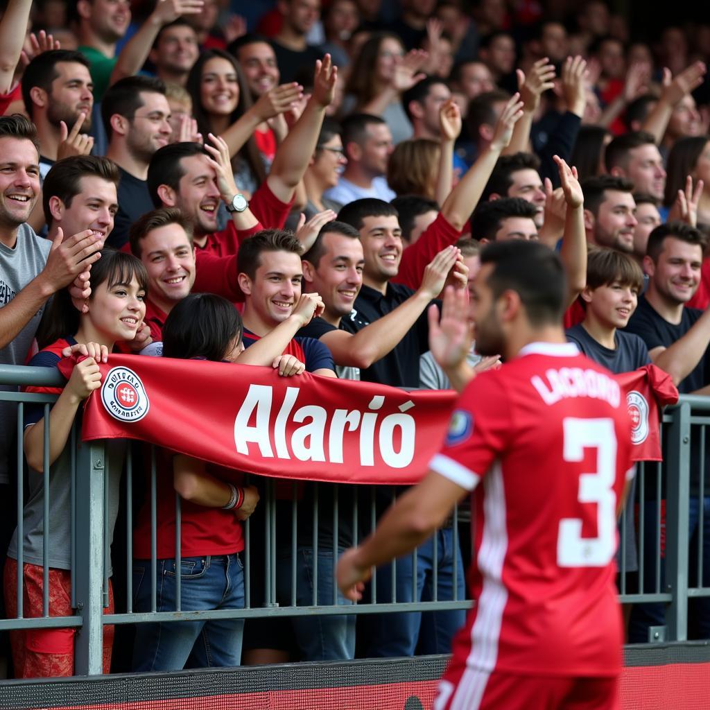 Lucas Alario feiert mit Leverkusen Fans