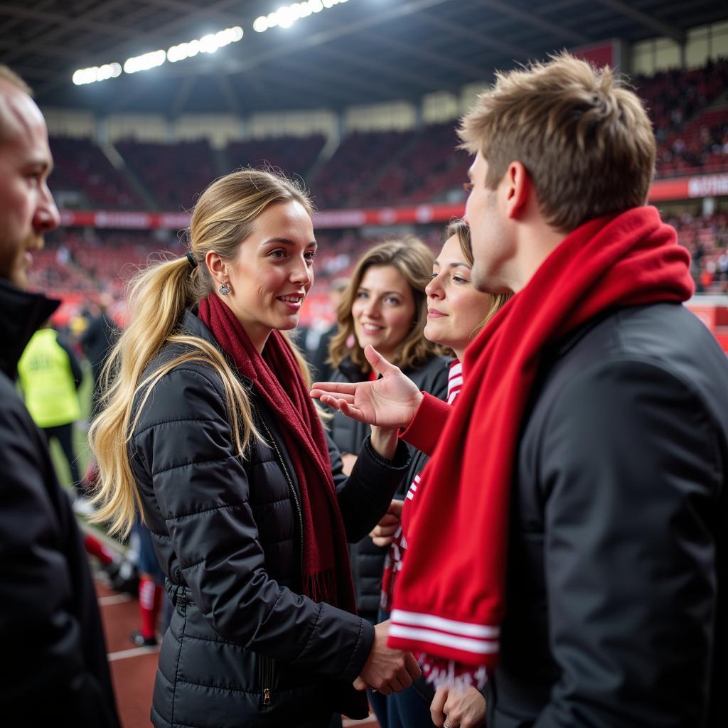 Andrea Hilgers im Gespräch mit Fans in der BayArena