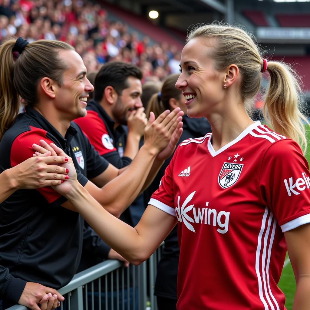 Annika Lange mit Fans von Bayer 04 Leverkusen