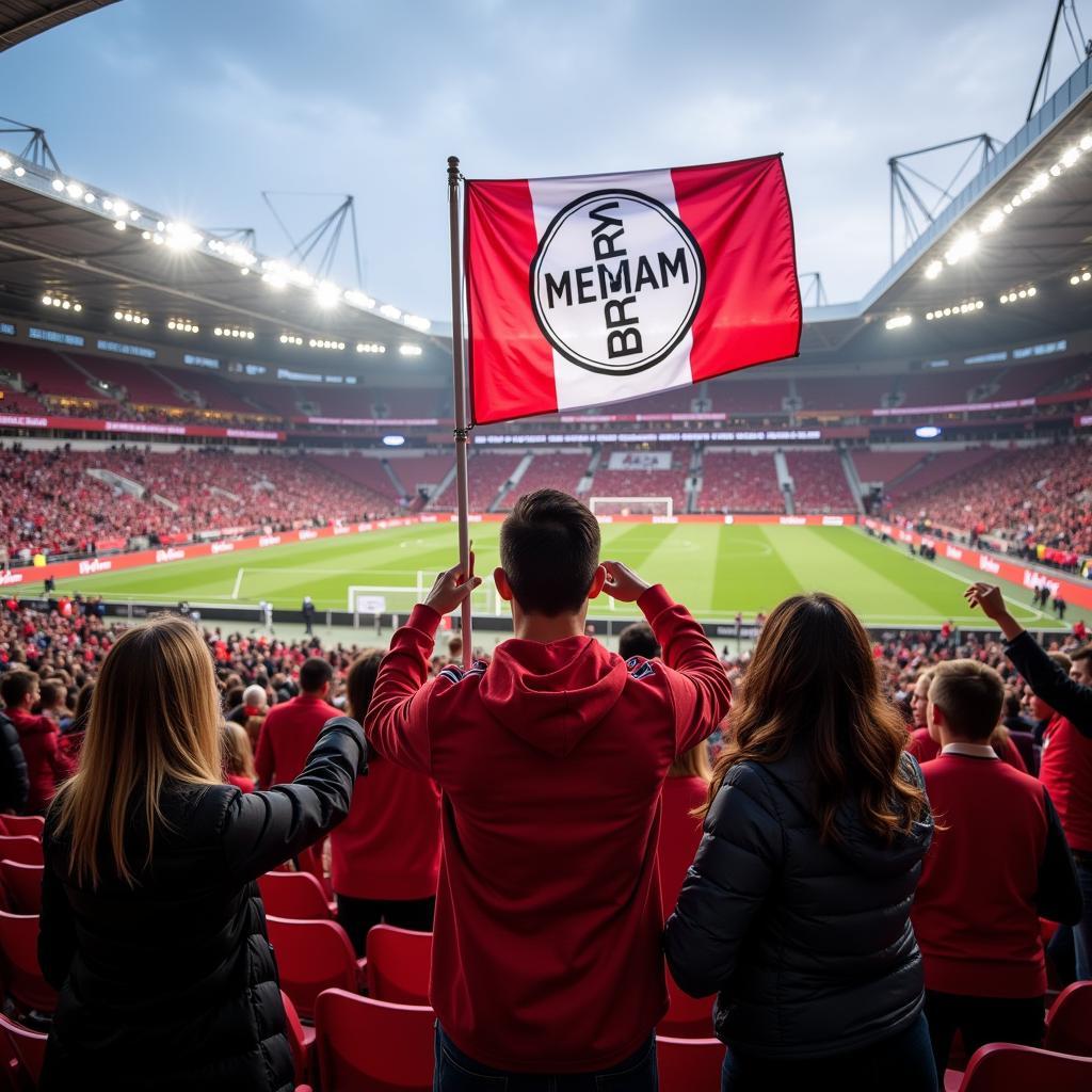 Fans von Bayer Leverkusen vor dem Stadion mit Automobile Werner Banner