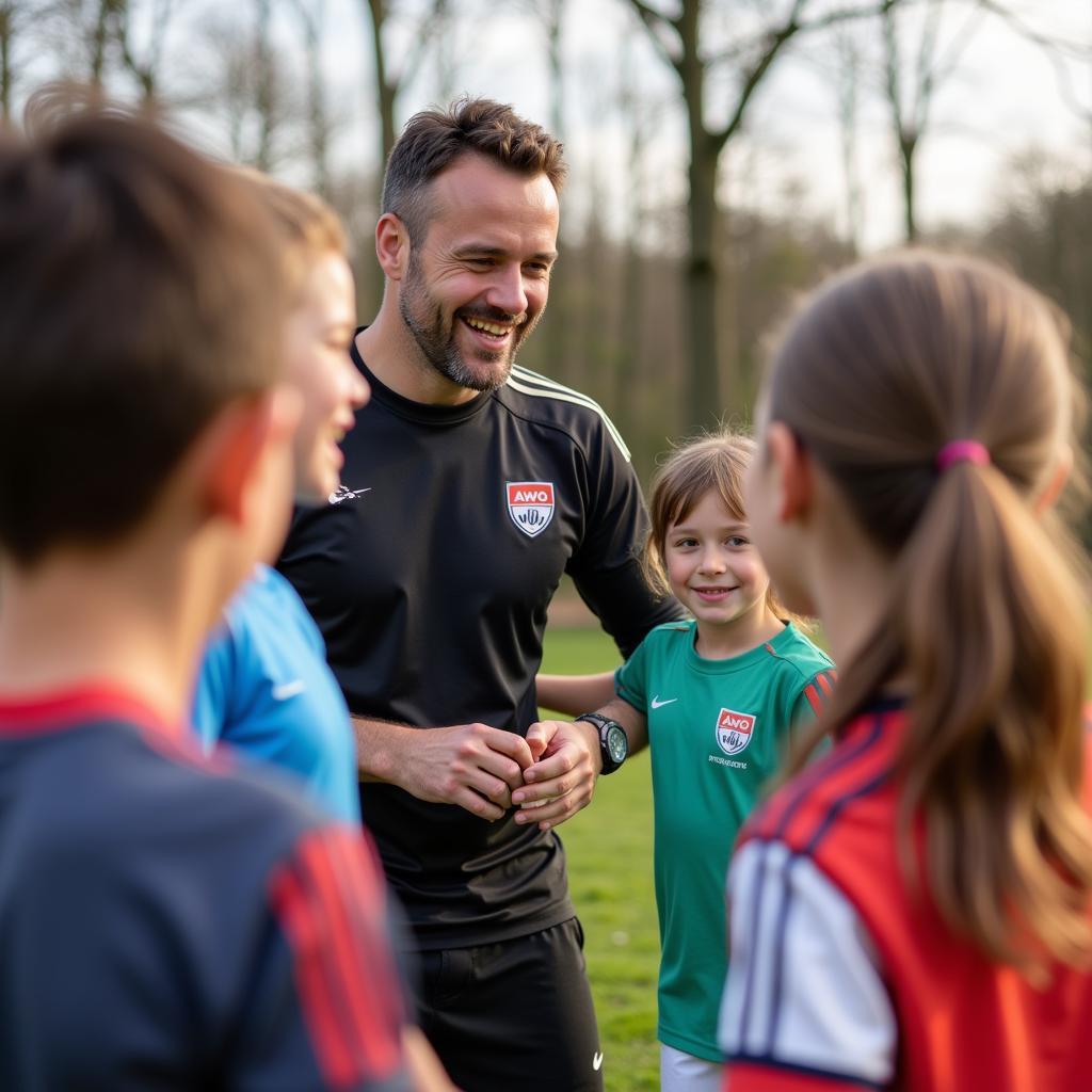 Trainer leitet Fußballübungen an