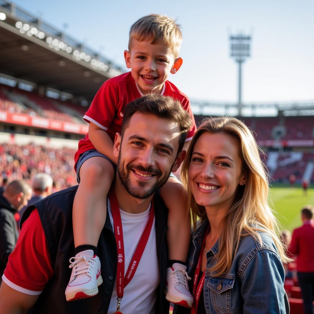 Glückliche Familie genießt einen Stadionbesuch an der Baumberger Straße in Leverkusen