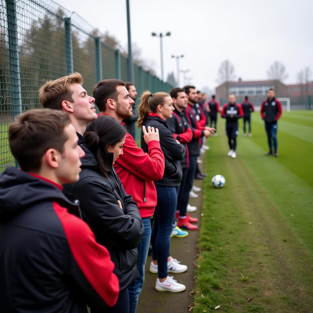 Fans warten am Eingang des Agternkamps Leverkusen