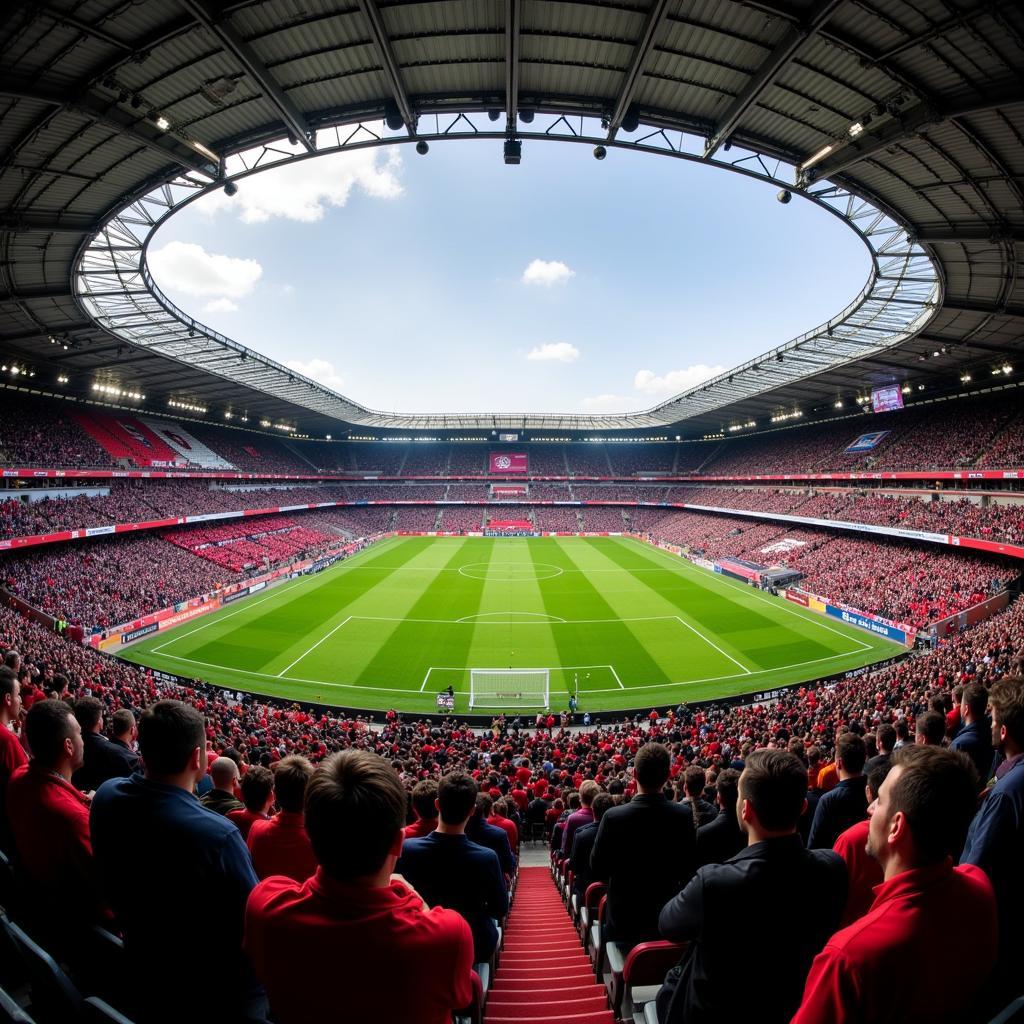 Fans von RB Leipzig und Bayer Leverkusen feiern im Stadion