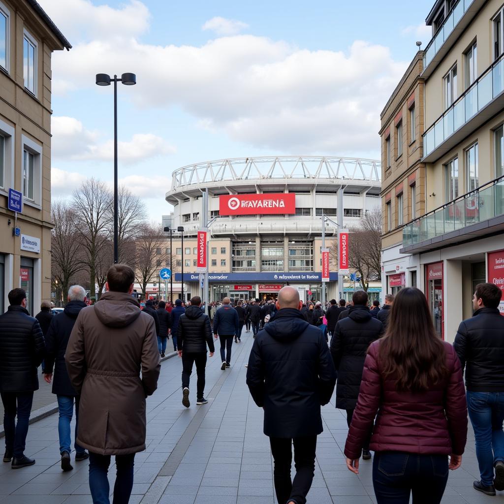 Fans auf dem Weg zum Stadion, das Leoso Hotel im Hintergrund