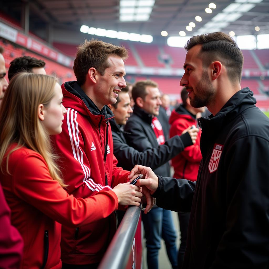 Josip Stanisic mit Fans in der BayArena