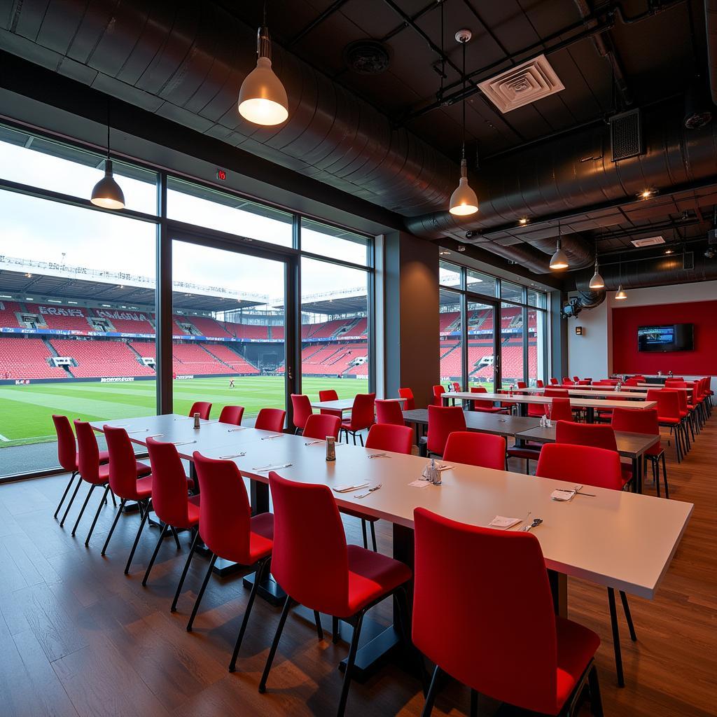 Moderner Partyraum in der BayArena Leverkusen mit Blick auf das Spielfeld