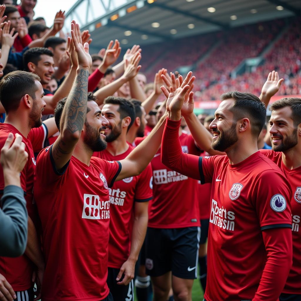 Spieler feiern mit den Fans