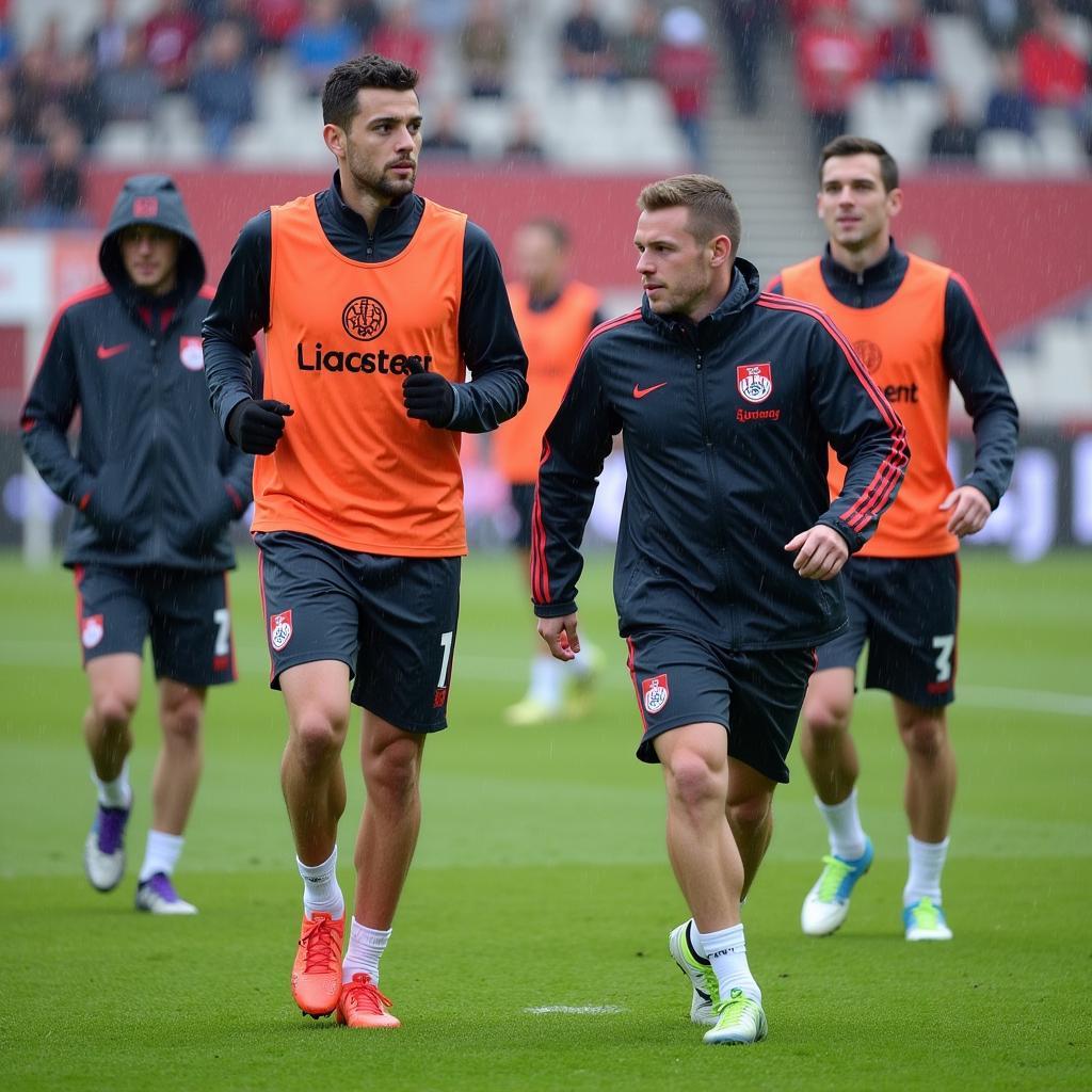 Spieler trainieren bei regnerischem Wetter in Leverkusen