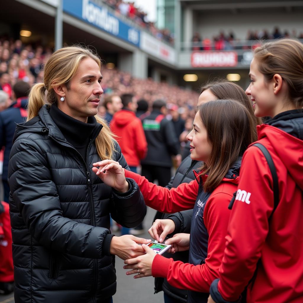 Adelheid Thieler im Gespräch mit Fans von Bayer Leverkusen