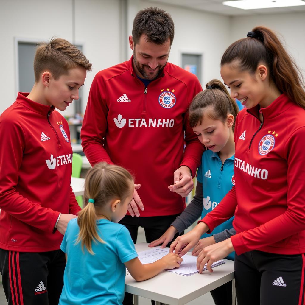 Vertreter von Bayer 04 Leverkusen und VfB Stuttgart bei der Aktion Kinder