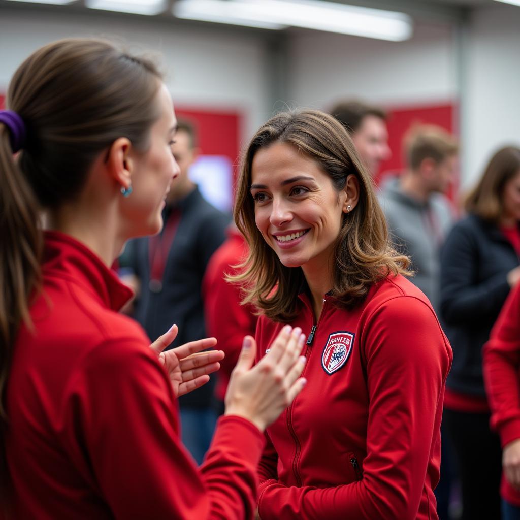 Andrea Frank im Gespräch mit Fans von Bayer 04 Leverkusen