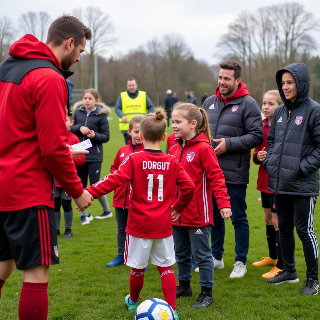 Bayer 04 Leverkusen Spieler besuchen die Aszrid-Lindgren-Schule