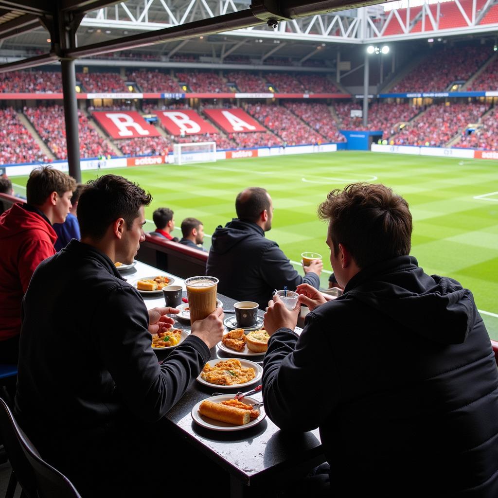 Fans genießen Snacks und Getränke an einem Imbissstand in der BayArena