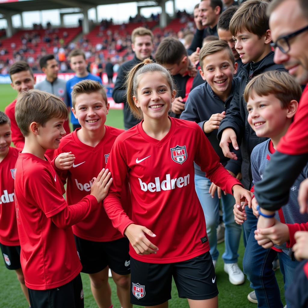 C-Jugend Mannschaft von Bayer Leverkusen mit Fans.