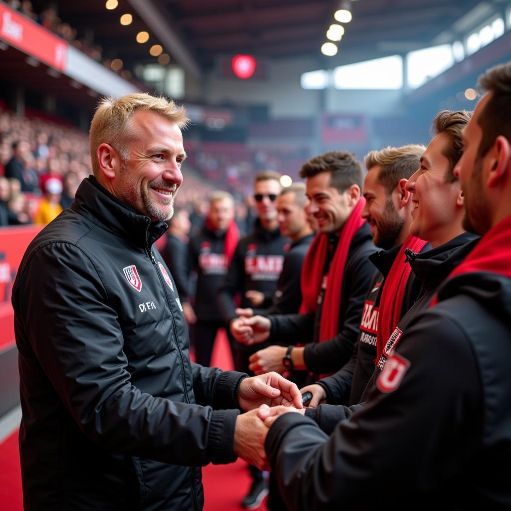 Reiner Calmund mit Fans in der BayArena