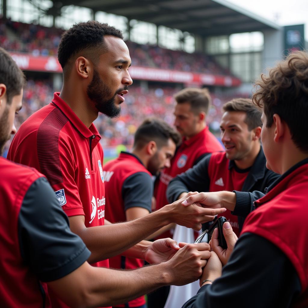 Adam Goman mit Fans von Bayer Leverkusen