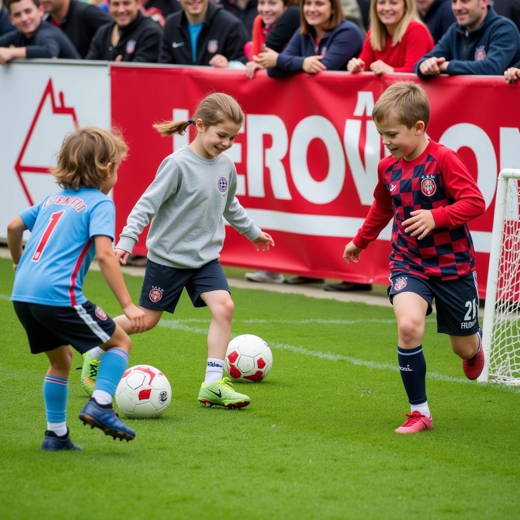 Kinder beim Fußballspielen während des Bayer Leverkusen Family Day 2019