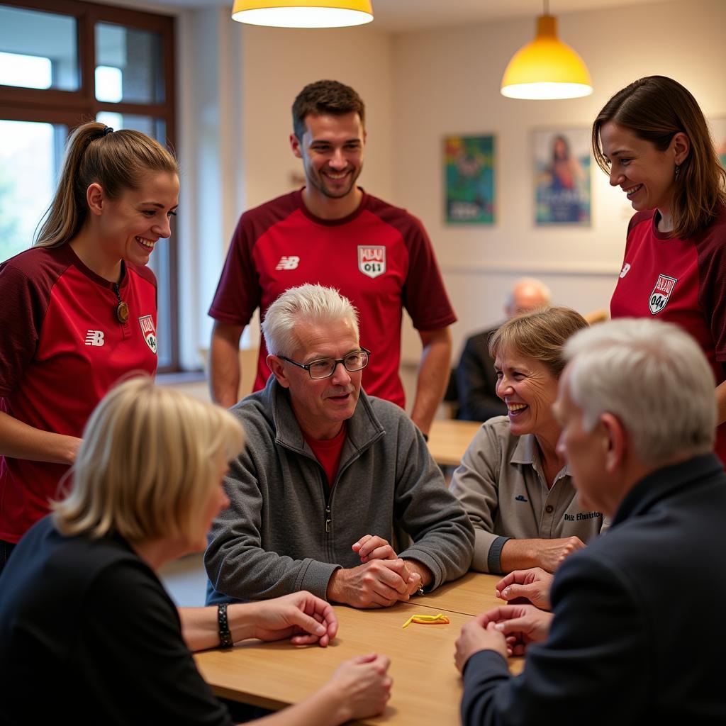 Spieler von Bayer 04 besuchen Bewohner im Altenzentrum St. Elisabeth