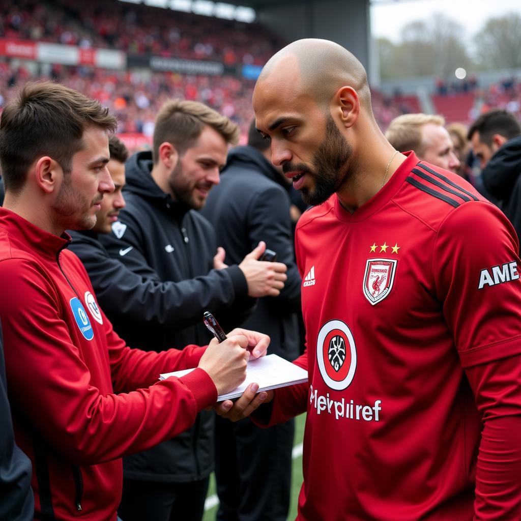 Sidney Sam interagiert mit Fans von Bayer Leverkusen