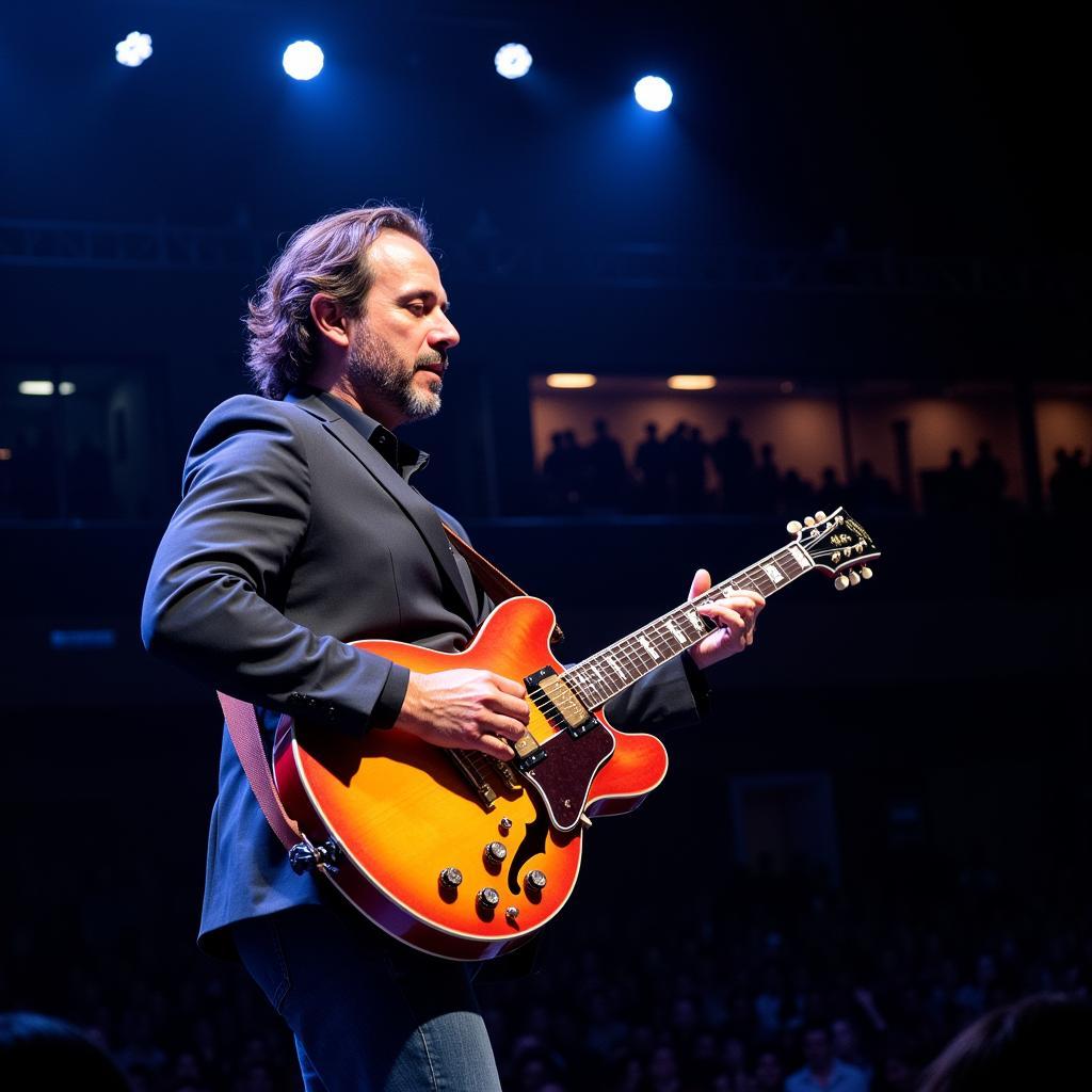 Al Di Meola spielt Gitarre auf der Bühne in Leverkusen 2019