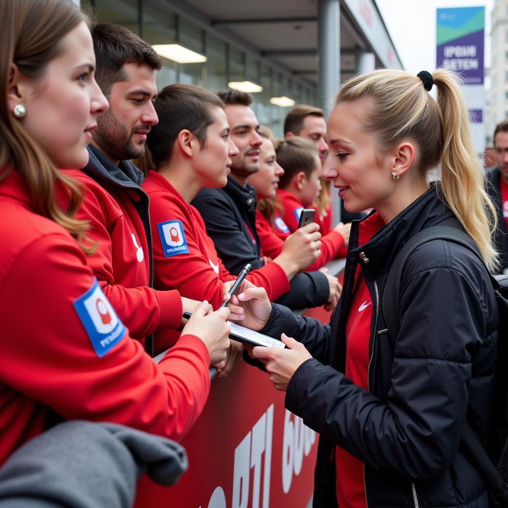 Anna Klink mit Fans von Bayer Leverkusen