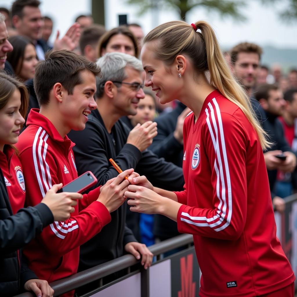 Anna Thieß mit Fans von Bayer 04 Leverkusen