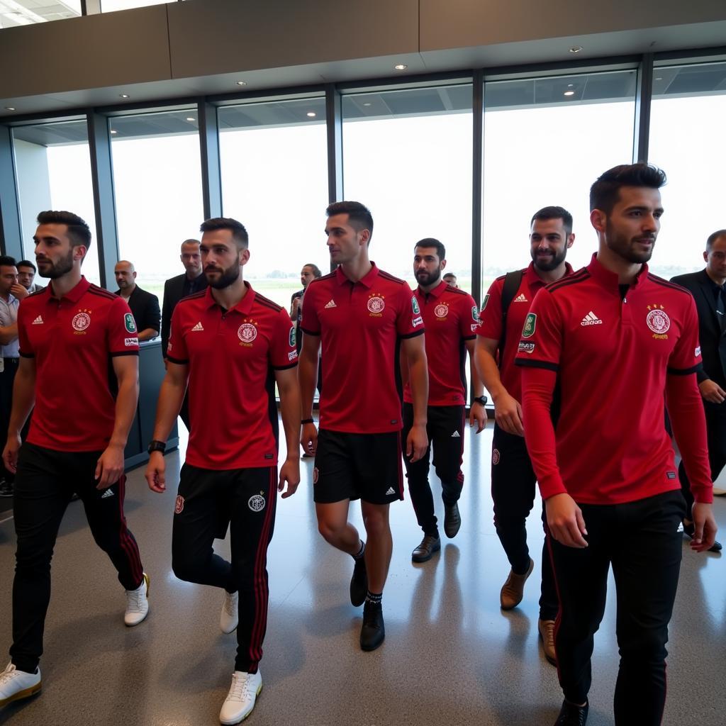 Die Mannschaft von Bayer Leverkusen kommt am Flughafen in Baku an.