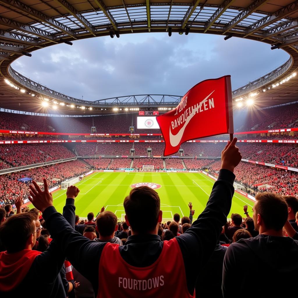 Bayer Leverkusen Fans feiern im Stadion.