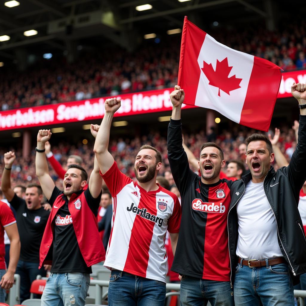 Fans von Bayer Leverkusen und Freiburg beim Spiel